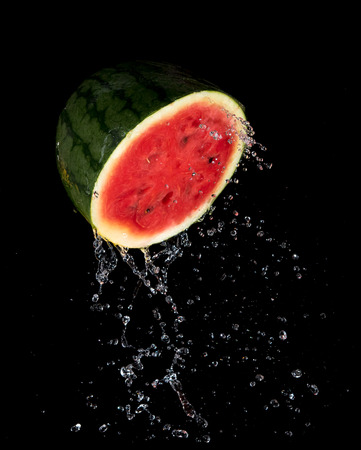 Sliced Watermelon with water splash flying in the air,Stop motionの写真素材