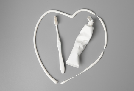 Toothbrush and toothpaste in shape of heart ,mock up