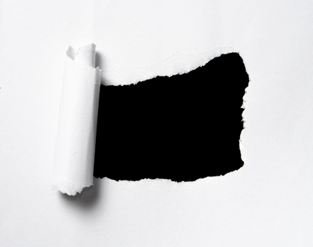 Torn paper with space for text with black backgroundの写真素材