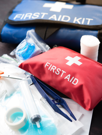 First aid medical kit on woodの写真素材
