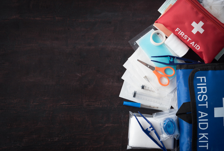 First aid medical kit on woodの写真素材