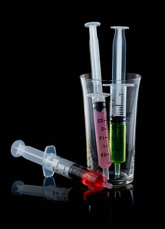 Children syringe for receiving cough syrup with syrup medicineの写真素材