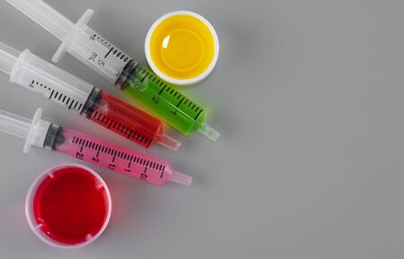 Children syringe for receiving cough syrup with syrup medicineの写真素材