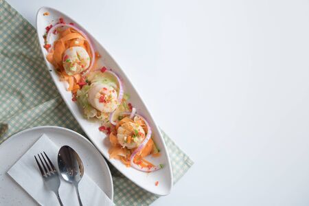 Scallops with spicy seafood sauceの写真素材