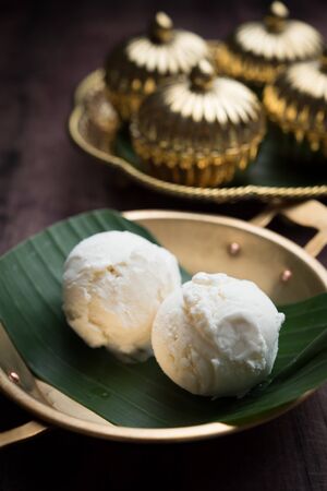Coconut milk ice cream on brass blowの写真素材