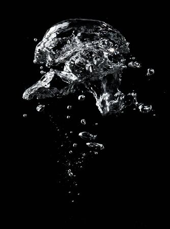 Air bubbles in the water on black background.の写真素材