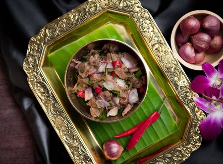 Stir Fried Pork with Shrimp Paste on wood table,Thai foodの写真素材