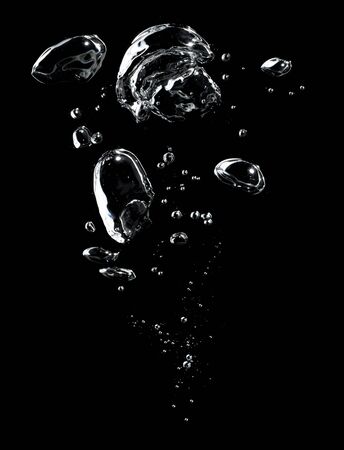 Air bubbles in the water on black background.の写真素材