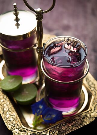 Butterfly pea juice with lime in cold glass, Anchan Thai flowerの写真素材
