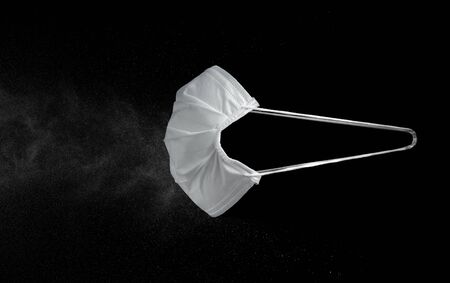 Medical mask, Medical protection mask against viruses, bacteria, smog isolated on black backgroundの写真素材