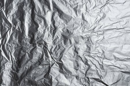 texture of crumpled aluminum foil paperの写真素材