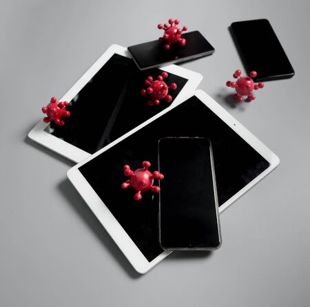 Coronavirus outbreak in 2019,Flu COVID-19 virus cell on smart phone and tablet,dangerous fluの写真素材
