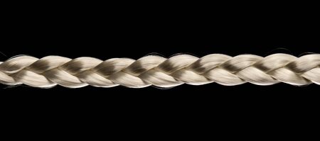 Braided blond hair isolated on black