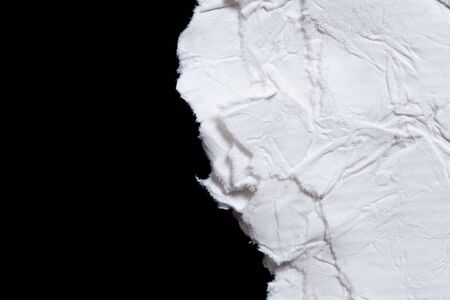 Old eco paper kraft,torn of crumpled white paper texture on black background with space for textの写真素材