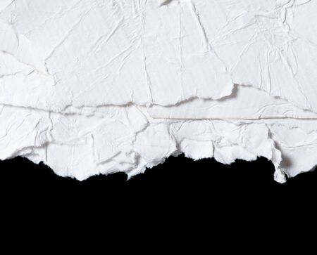 Old eco paper kraft,torn of crumpled white paper texture on black background with space for text