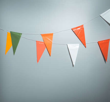 Party flags for decoration and covering on grey backgroundの写真素材
