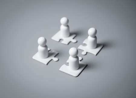 Wooden people standing on puzzles ,human resources and management concept,teamworkの写真素材