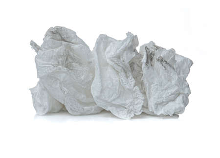 Crumpled used white tissue paper isolated on white backgroundの写真素材