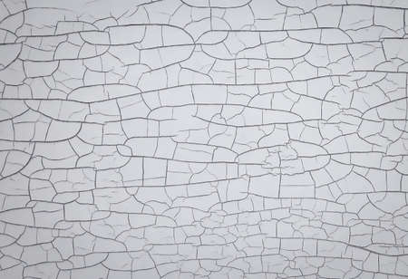 Cracked paint on white black wall