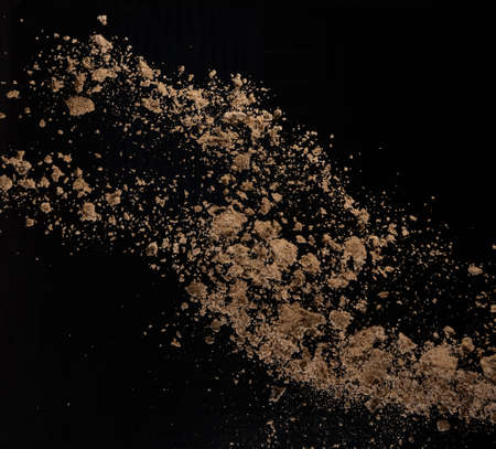 Sandy explosion isolated on over dark background,Abstract sand cloud,Motion blur