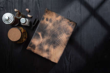 Cutting board over towel on wooden table,Top view