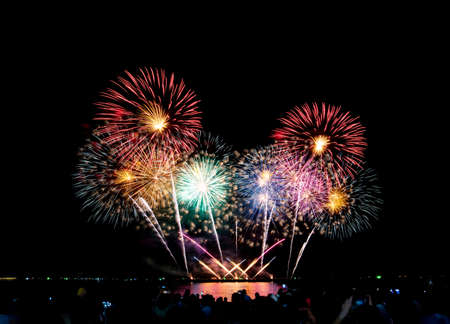 Fireworks light up the sky,Crowd watching fireworks and celebrating for Christmas and New Year...