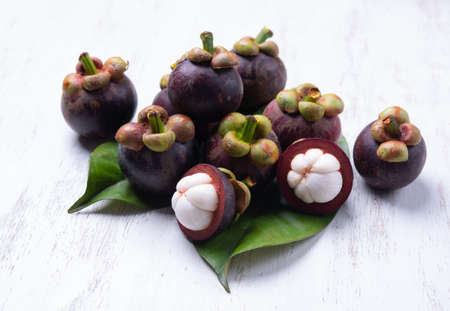 Thai fruit,Tropical mangosteen on white wood tableの写真素材