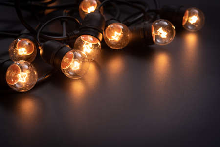 Vintage light bulb and dark space backgroundの写真素材