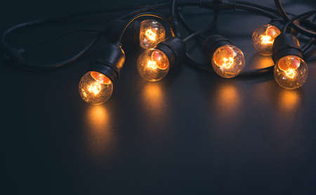 Vintage light bulb and dark space backgroundの写真素材