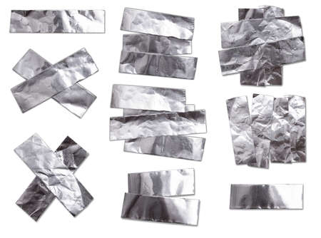 aluminum foil tape shapes cuts isolated on white background for padding or fix leaking toolの写真素材