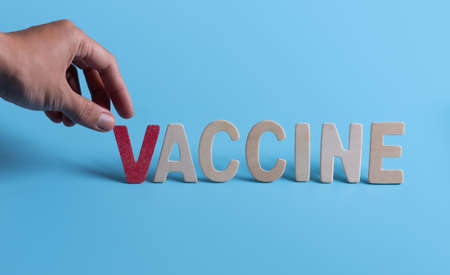 Word "VACCINE" on blue background,Healthcare and vaccine Conceptの写真素材