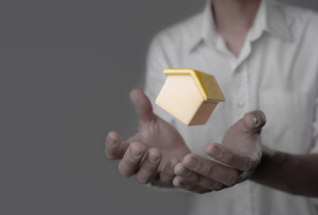 New home and house concept,businessman holding model houseの写真素材