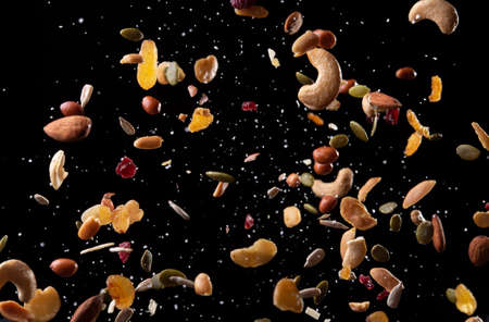 Explosion of mix of beans over a black backgroundの写真素材