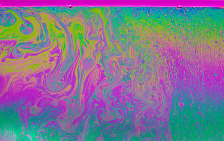 Surreal patterns with rainbows and waves of color in motion of a soap bubble,colorful patterns