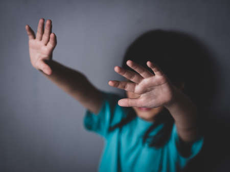 Young girl making stop gesture with her hand,Stop violence and abuse children. human trafficking concept.の写真素材
