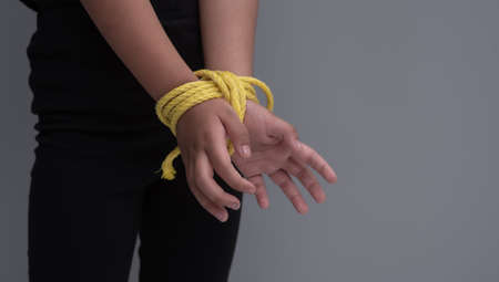 Child's hands tied with rope ,kidnapping conceptの写真素材