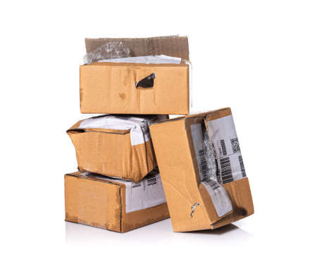 damaged cardboard parcel on white background