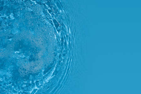 Shining blue water ripple background. Summer concept.の写真素材