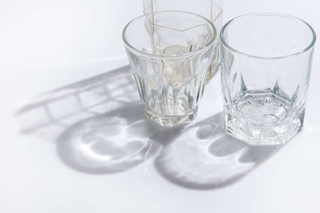 Shadow of glassware with liquid,sunshine throughの写真素材