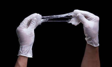 Test for sticky cosmetic lotion or gel against a black backgroundの写真素材