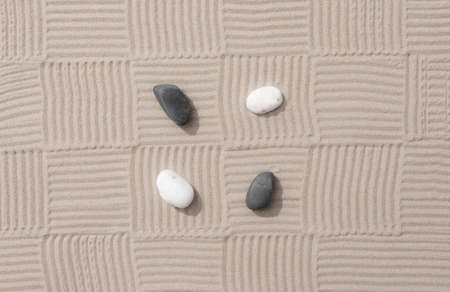 Zen garden japanese garden zen stone with zen pattern in sand as backgroundの写真素材
