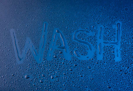 Word - WASH,Handwritten text on wet glass,Water drops on the window glassの写真素材