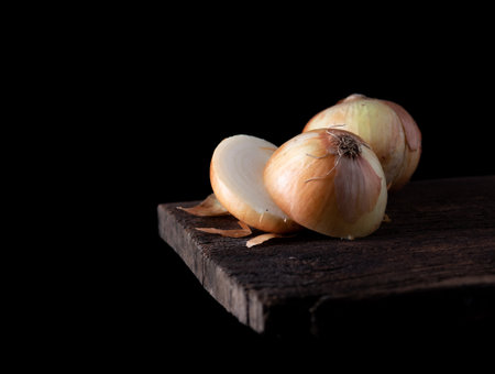 White onions on a rustic wooden,dark background,Copy spaceの写真素材