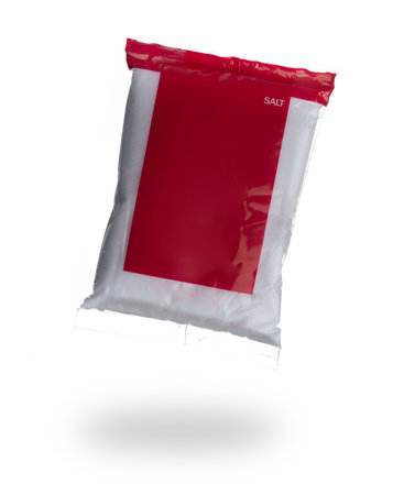 Salt in plastic bag isolated on white backgroundの写真素材