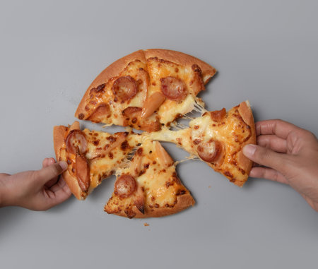 Friends sharing pizza ,Copy space. The view from the top. flat layの写真素材