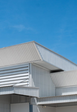 metal sheet roofing on commercial construction with blue skyの写真素材