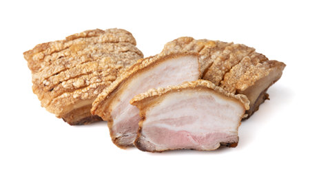 crispy pork belly or deep fried pork isolated on white backgroundの写真素材