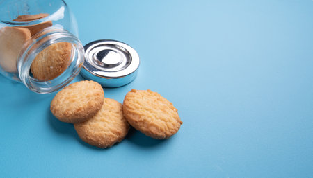 Jar of  cookie on blue background,Space for text and content