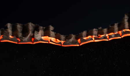 Burning paper on black background,Burnt paper edges.