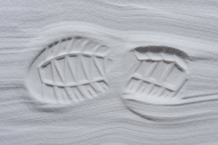 Footprint of shoe in the white sandの写真素材